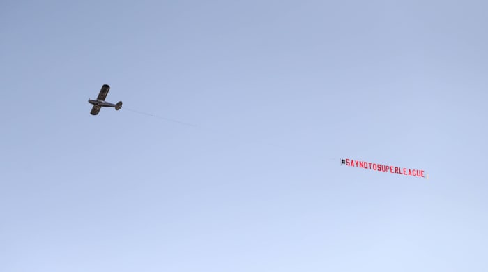 A plane flying over Old Trafford protesting the Super League.